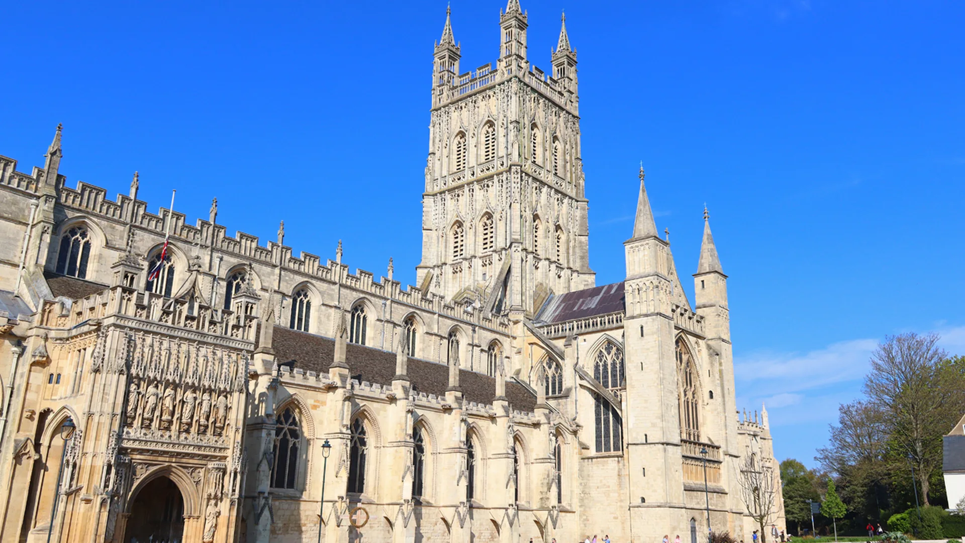 Gloucester Cathedral in Gloucestershire under a clear blue sky