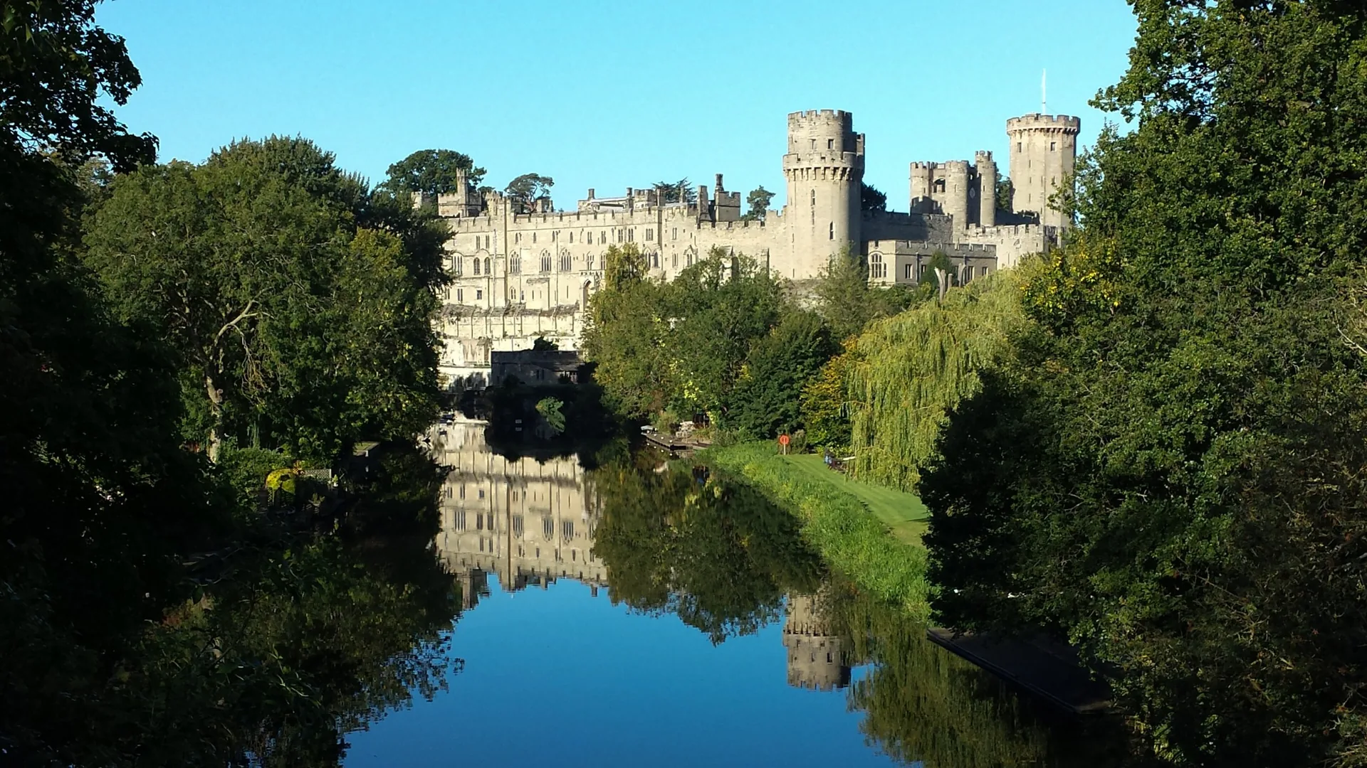 Warwick Castle reflected in the River Avon in Warwickshire
